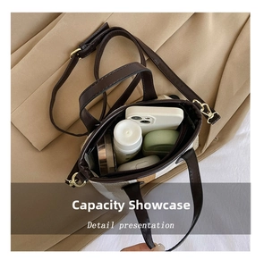 Internal view of the striped canvas bag showing space for phone and cosmetics