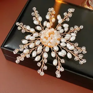 Handcrafted pearl and crystal flower brooch with gold wire weaving on black leather