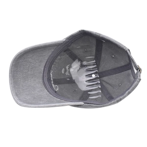 Detail of the vintage washed grey baseball cap showing internal seams and metal buckle