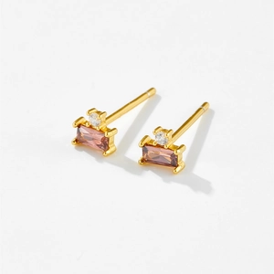 Detailed close-up of S925 silver stud earrings with purple rectangle stones and gold plating