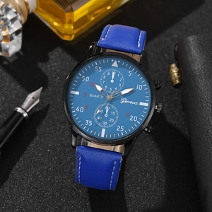 Blue leather watch with quartz movement and chronograph dial on a premium business desk