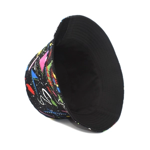 Detail view of graffiti pattern on black canvas bucket hat with reinforced brim