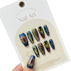 Handmade cat eye press-on nails with celestial black cat silhouettes and starry sky design