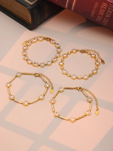 Detailed close-up of gold plated stainless steel bracelets with sparkling zircon stones