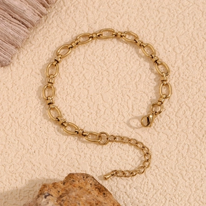 Detailed view of 14K gold-plated oval link bracelet with adjustable lobster clasp