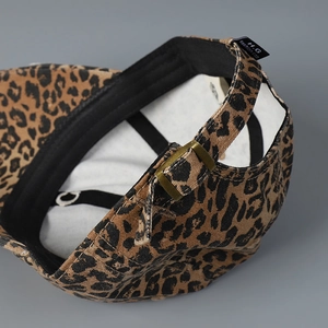 Close-up of leopard embroidery baseball cap with metal buckle and premium stitching