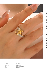 Detail view of gold wrench ring with white enamel moon star and Forever engraving