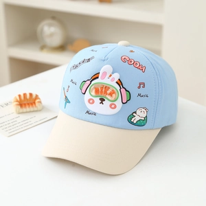 Detail view of cartoon rabbit embroidery and blue brim on kids baseball cap