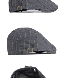 Détail d'une casquette en coton à rayures grises avec boucle de réglage en bronze
