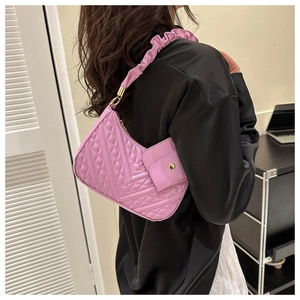 Pink quilted shoulder bag with V-stitch texture, ruched handle and small purse attachment
