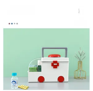 Detail of ambulance-shaped first aid box featuring red handle and a buckle lock