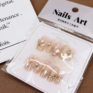 Dragon scale shimmering light pink press-on nails with luxury champagne rhinestones
