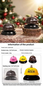 Close-up of pink, yellow and brown tinplate call bells in PVC packaging boxes
