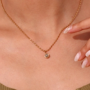 18K gold-plated stainless steel chain necklace with round gray natural stone on model