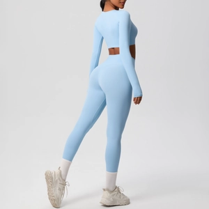 Detail of light blue two-piece yoga set with long sleeve crop top and high waist leggings