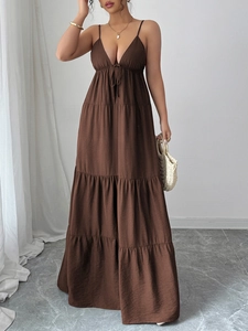 Detailed view of brown spaghetti strap tiered maxi dress with plunging V-neckline