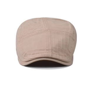 British vintage khakhi plaid patchwork newsboy cap with quilted texture and distressed style
