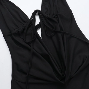 Detail of sexy black backless jumpsuit featuring tie-up drawstring and ruched chest fabric