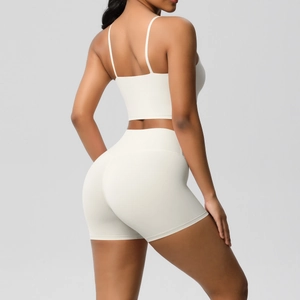Detail view of the back of a beige breathable yoga set featuring high waist sports shorts