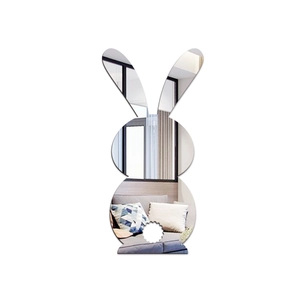 Detailed mirror view showing acrylic bunny wall sticker reflecting home living room decor