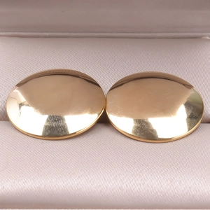 Detailed view of polished 304 stainless steel gold hoop earrings in a jewelry box