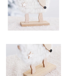 Close-up of wooden base and plush texture of a white reindeer Christmas ornament