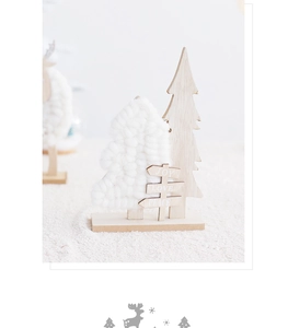 Detail of wooden Christmas tree with white faux fur and Joy Love Peace signs