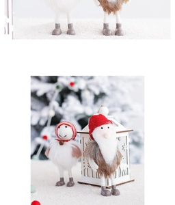 Close-up of wool felt Christmas snowman and Santa dolls with soft knit hats and bells