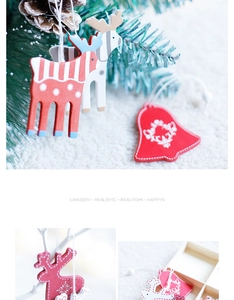Close-up of Nordic style wooden Christmas tree ornaments with reindeer and snowflake patterns