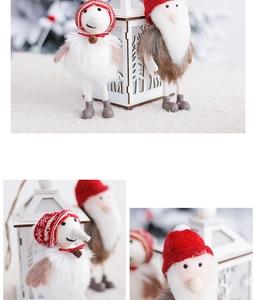 Close-up of wool felt Santa Claus and snowman dolls with soft knit hats and plush beards