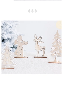 Detail of wooden Christmas reindeer and tree desk ornaments with natural wood finish