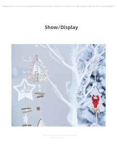 Detail of Nordic wooden Christmas pendants with star and reindeer motifs on white branches
