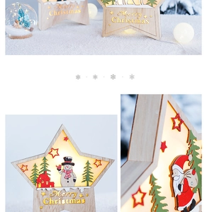 Detail of wooden LED star box with snowman and Santa carvings for Christmas desk decor