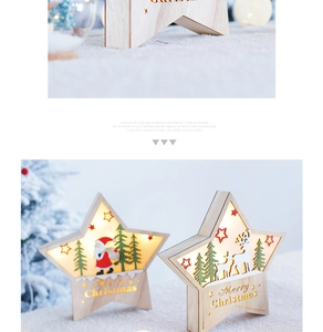 Detail of wooden Christmas star LED lights featuring Santa and reindeer carved patterns