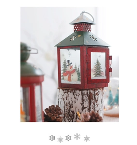 Christmas metal lantern on white wood stump with festive pine cones and winter backdrop