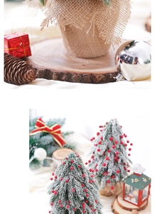 Detail of snowy Christmas tree base with burlap wrap, red berries, and pine cones