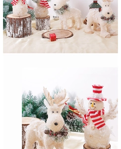 Detail of sisal Christmas snowman and reindeer figurines with rustic pine cone decor