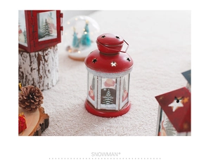 Macro view of Christmas iron wind lantern with Santa Claus print on glass and metal frame