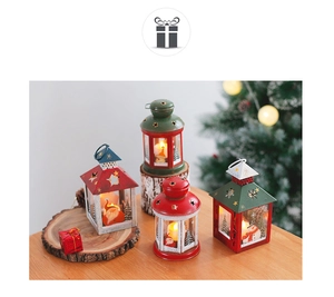 Close-up of Christmas iron lanterns with LED candles showing Santa and snowman patterns