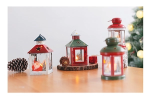 Classic metal and glass Christmas lanterns with festive Santa and tree patterns