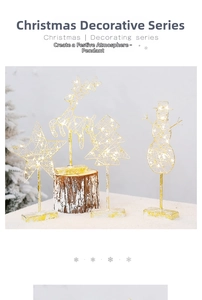 Golden iron Christmas tree ornaments with warm LED lights and elegant reindeer silhouette
