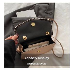 Detailed internal view of small beige crossbody bag showing phone and card wallet storage