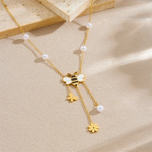 Golden stainless steel necklace featuring a honeybee pendant with white pearls and tassels