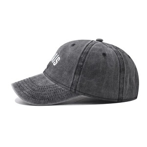 Detailed side view of washed cotton baseball cap with embroidered Paris lettering