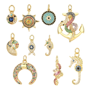 Gold-plated ocean charms with colorful zircons featuring sun, moon, and sea animal motifs