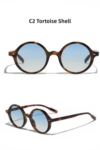 Detail of retro round tortoiseshell sunglasses with gradient blue lenses and bold temples