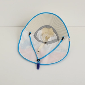 Detail of children's sun hat featuring neck protection mesh and adjustable blue chin strap