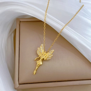 Elegant gold titanium butterfly fairy necklace with sparkling crystals on white silk