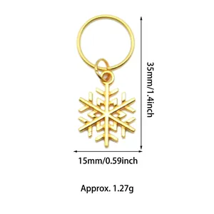 Detailed view of a gold snowflake pendant charm with dimensions 35mm by 15mm