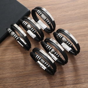 Detailed set of six men's black leather braided bracelets with metallic charms and magnetic clasp